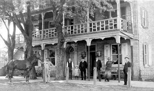 A local townsman poses in front of the Butztown Hotel