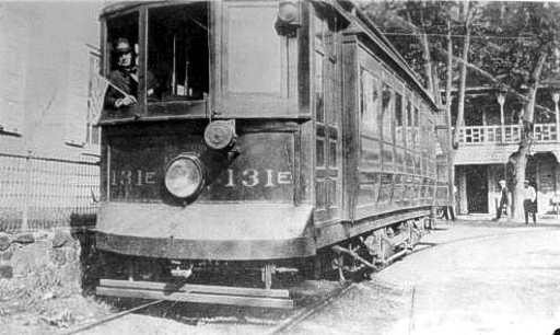 Trolley conductor in front of the Butztown Hotel